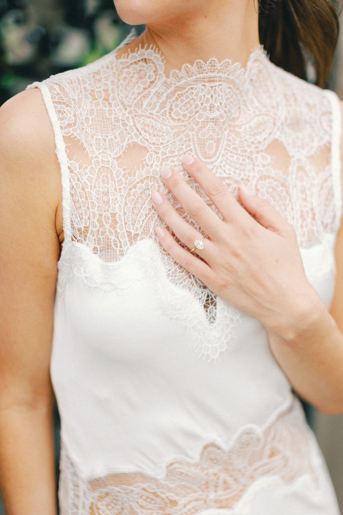Bridal ring shot on lace gown
