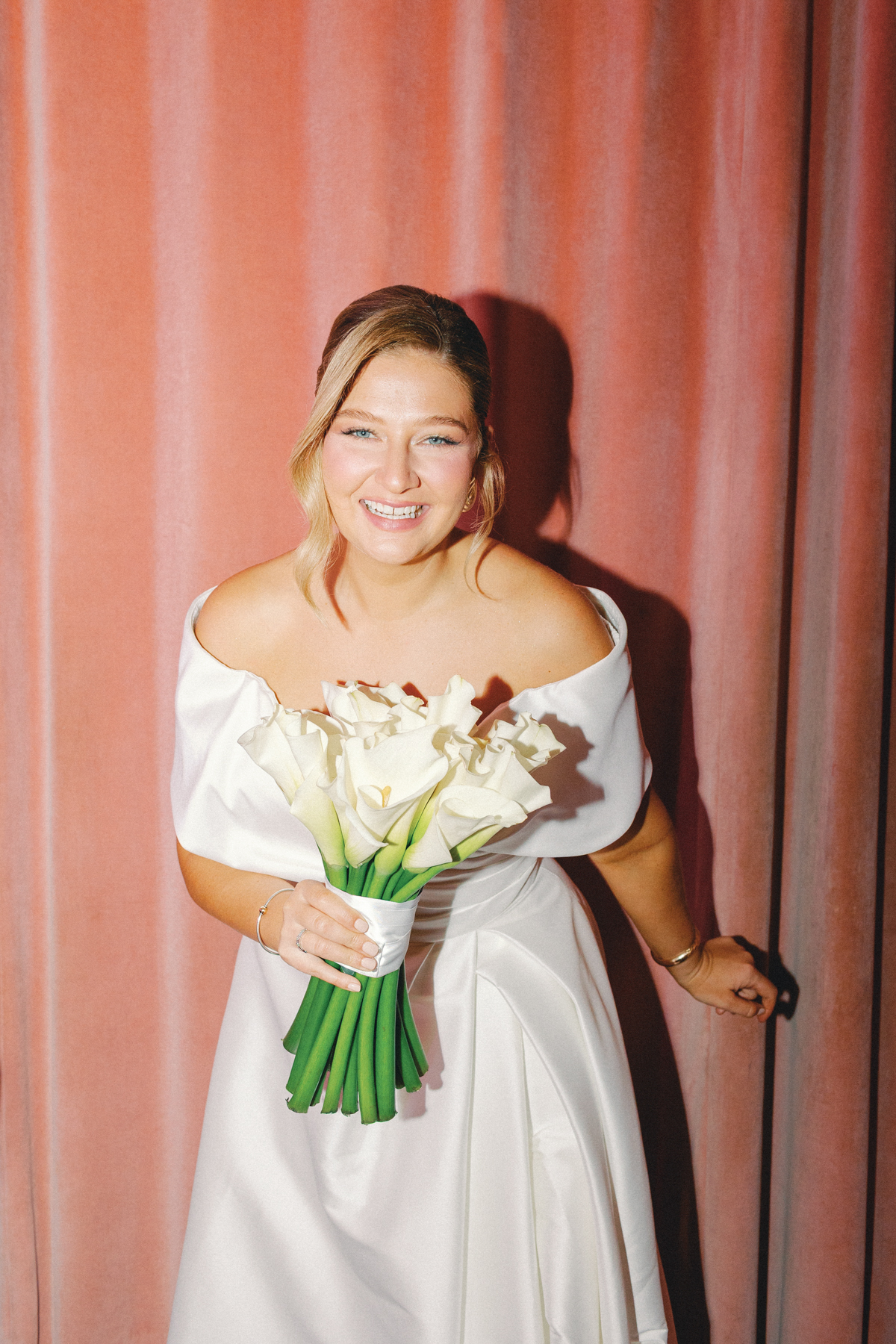 Bride laughing at camera