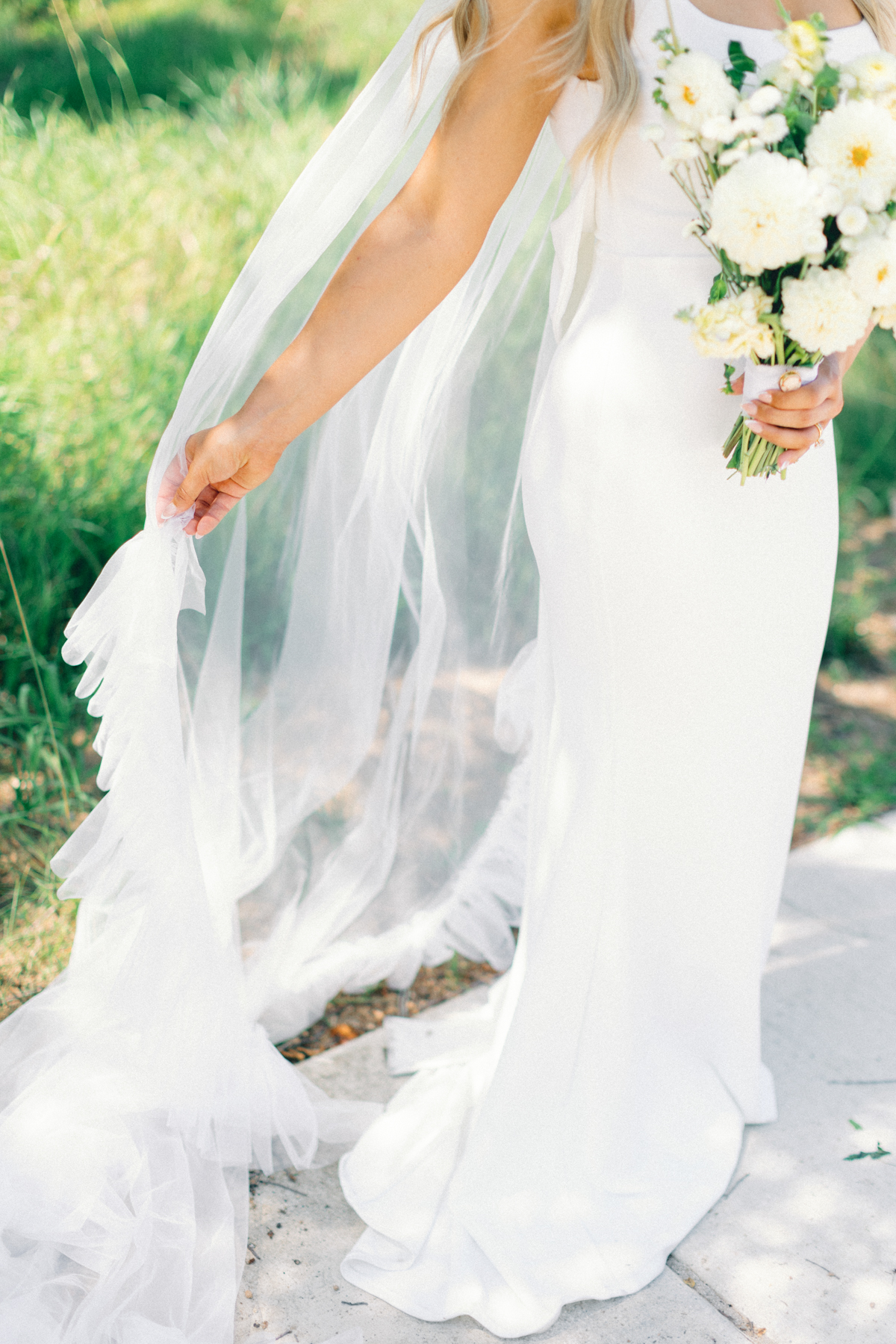 Bride playing with veil