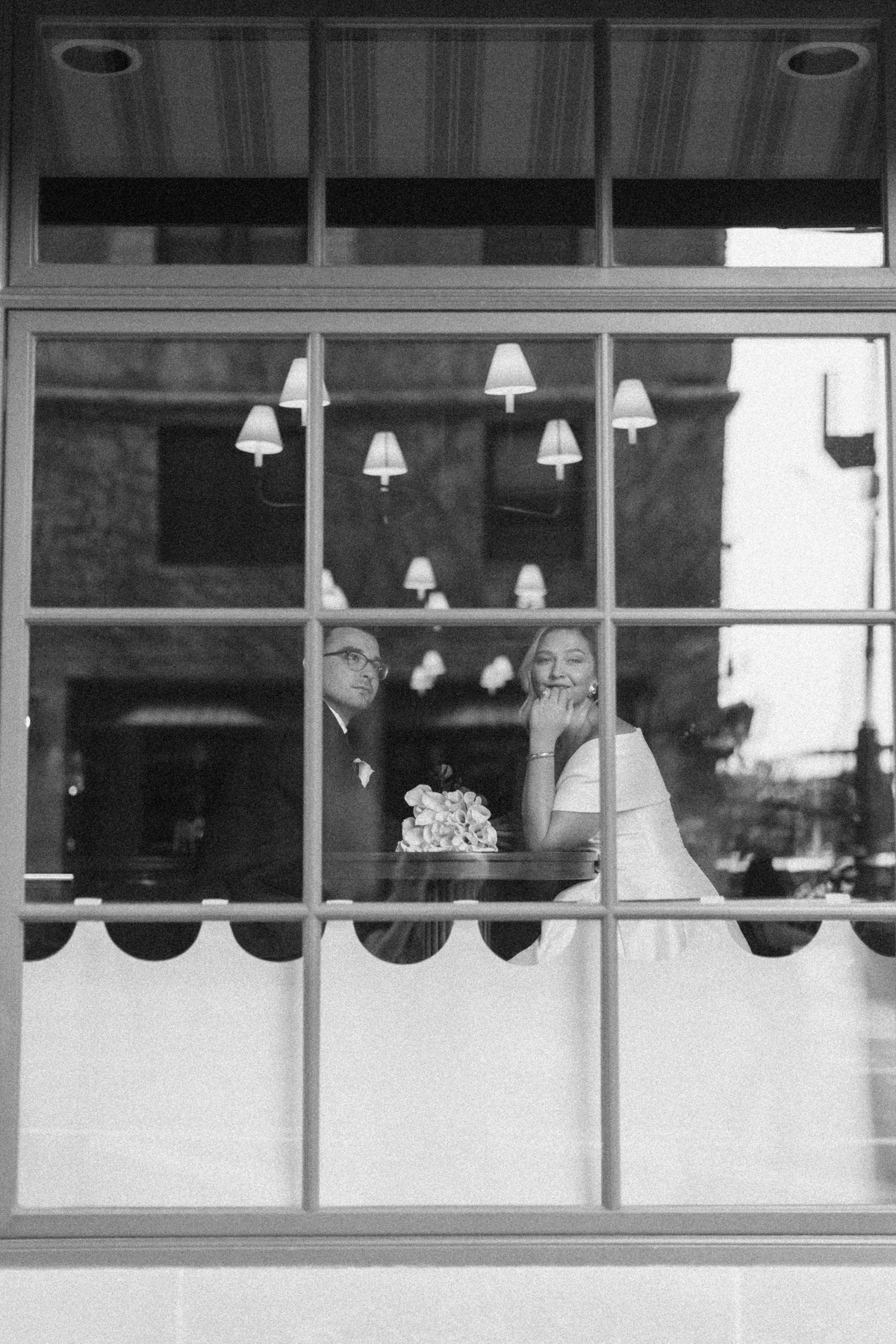 Bride and groom window shot