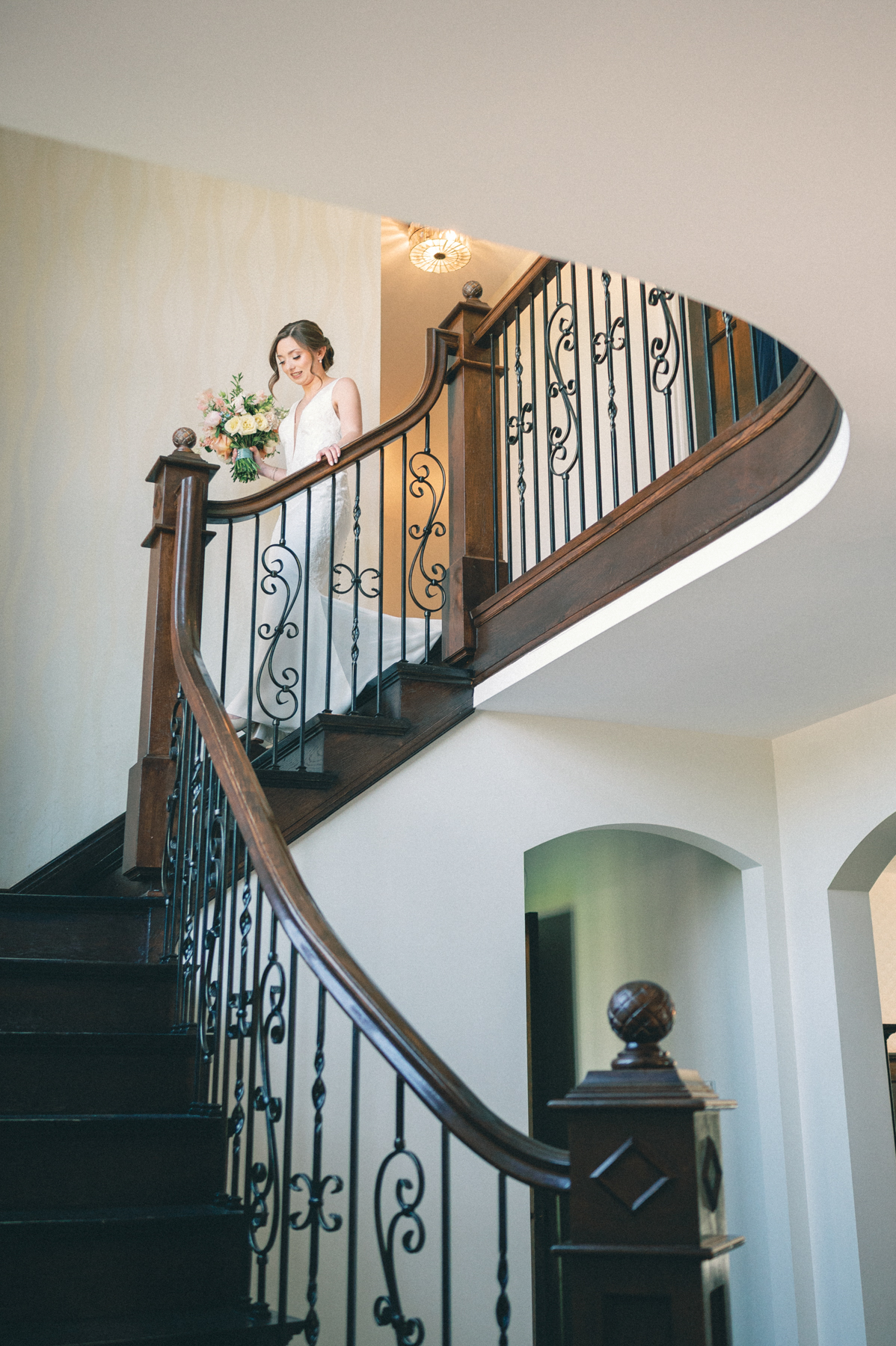 Bride walking downstairs