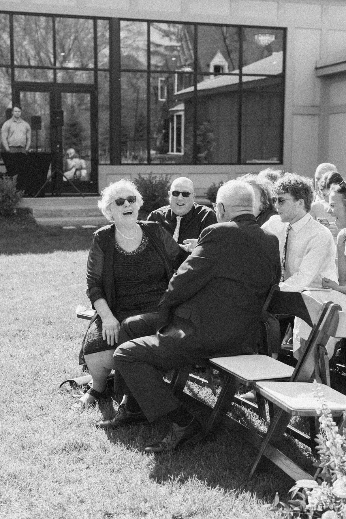 Wedding guest, laughing black-and-white, and