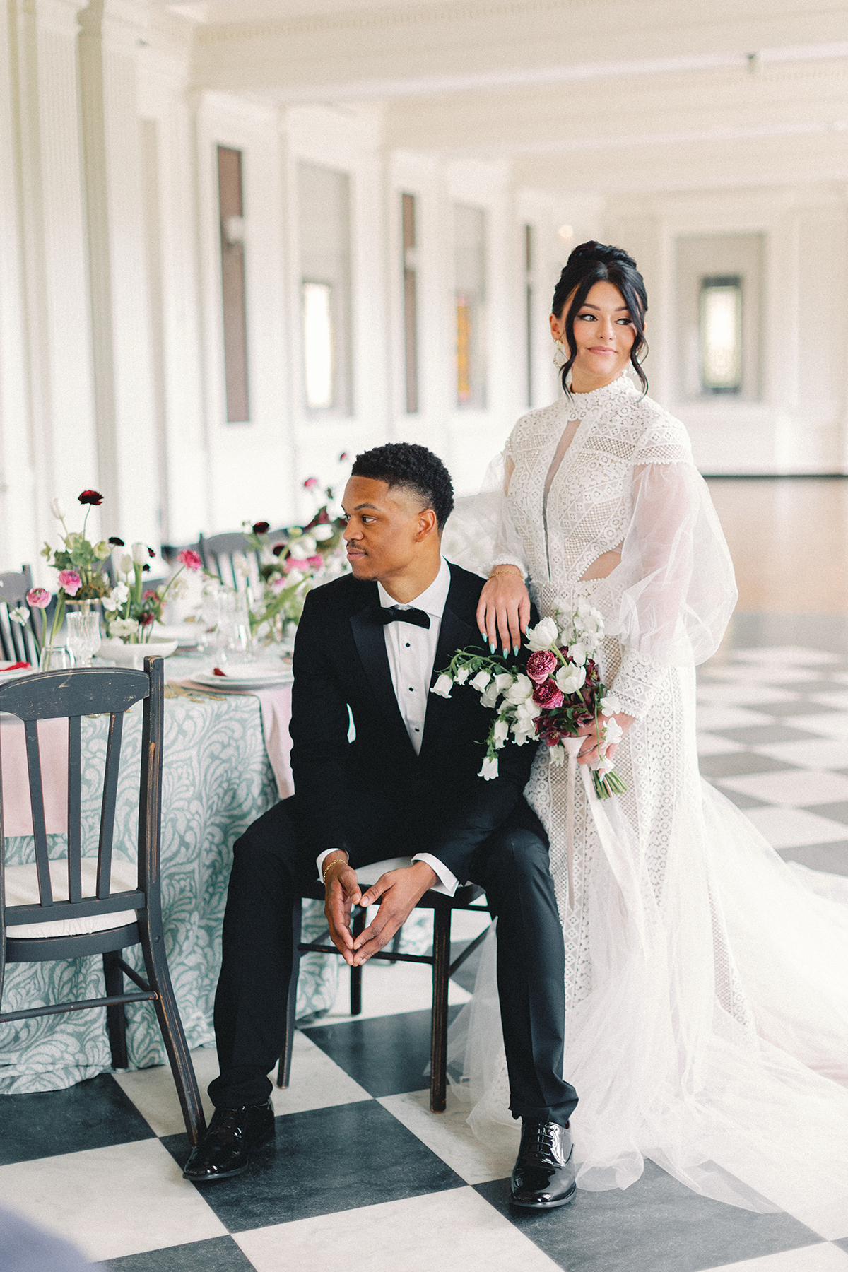 Pride and (groom) sitting at reception table