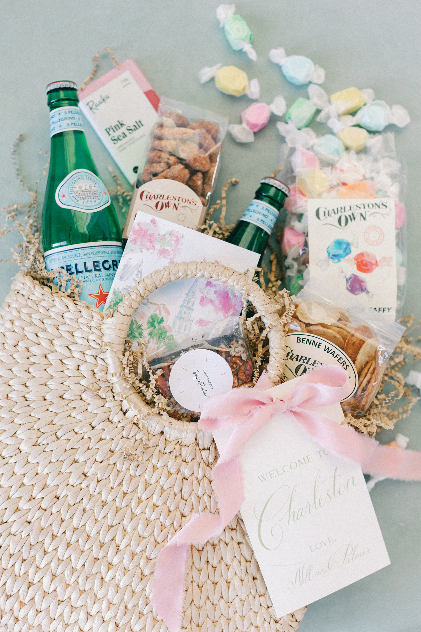 Charleston welcome gift basket with local candy, benne wafers, and a calligraphy note for out-of-town wedding guests