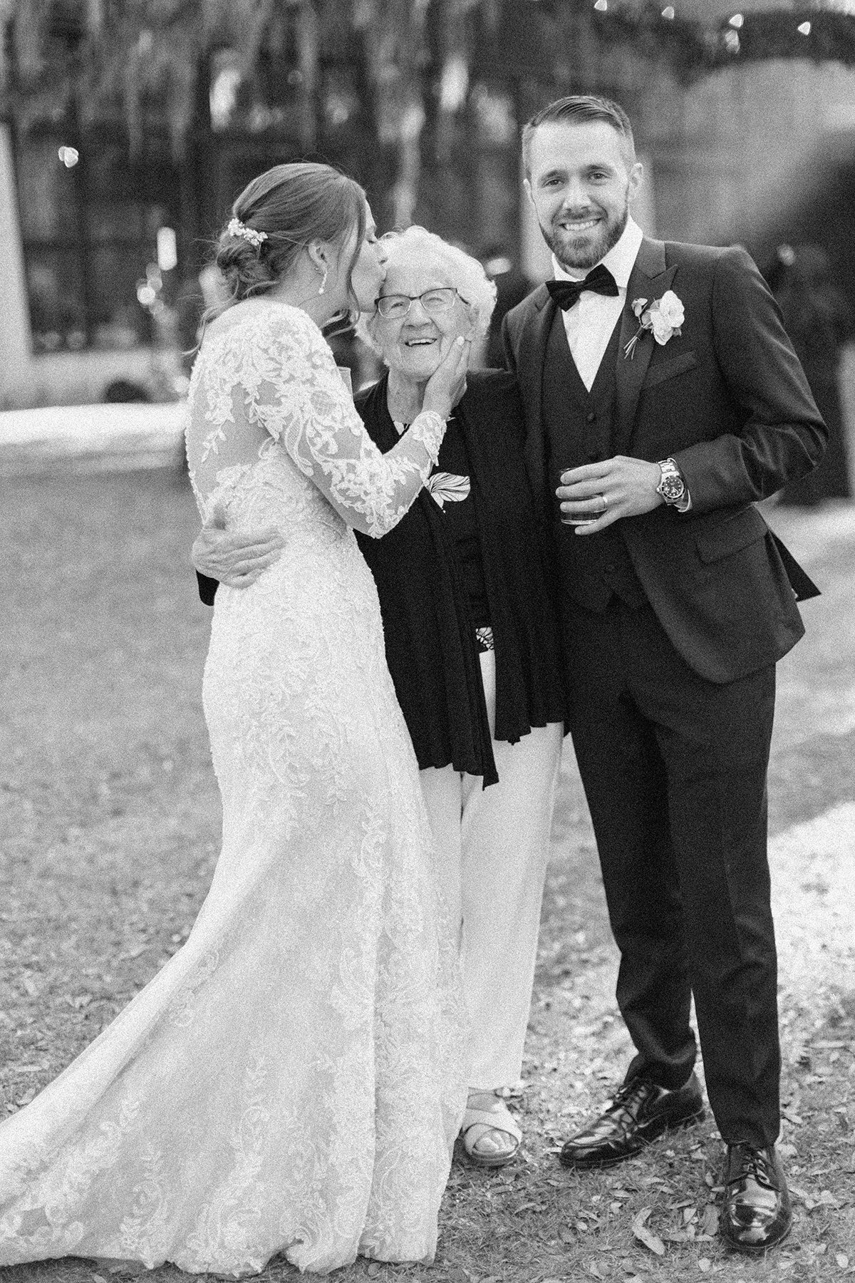 Couple kissing Grandma