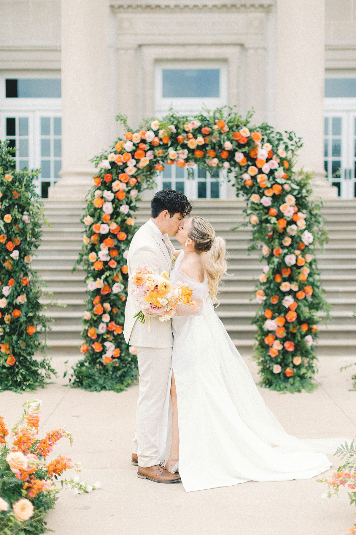 couple kissing after ceremony