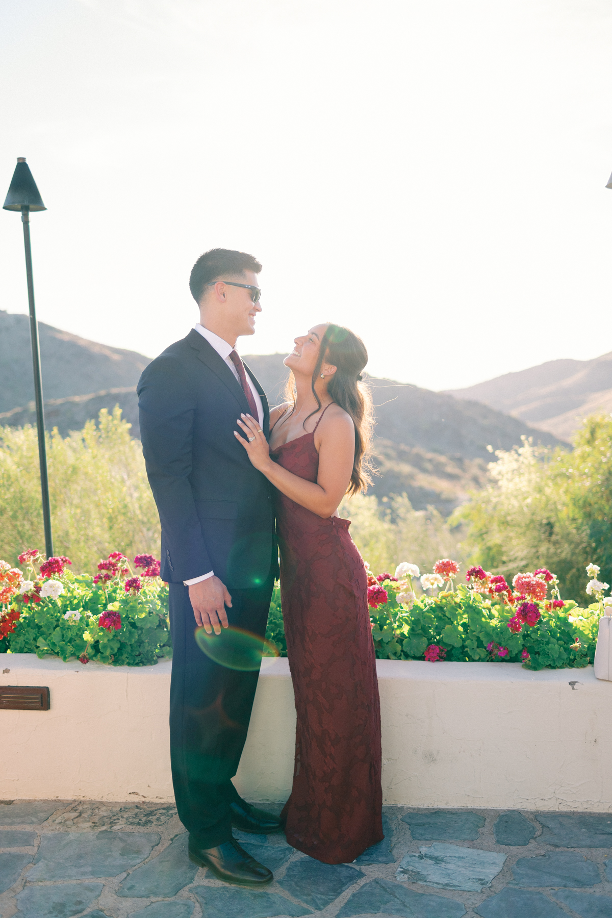 Cocktail hour portrait couple of laughing