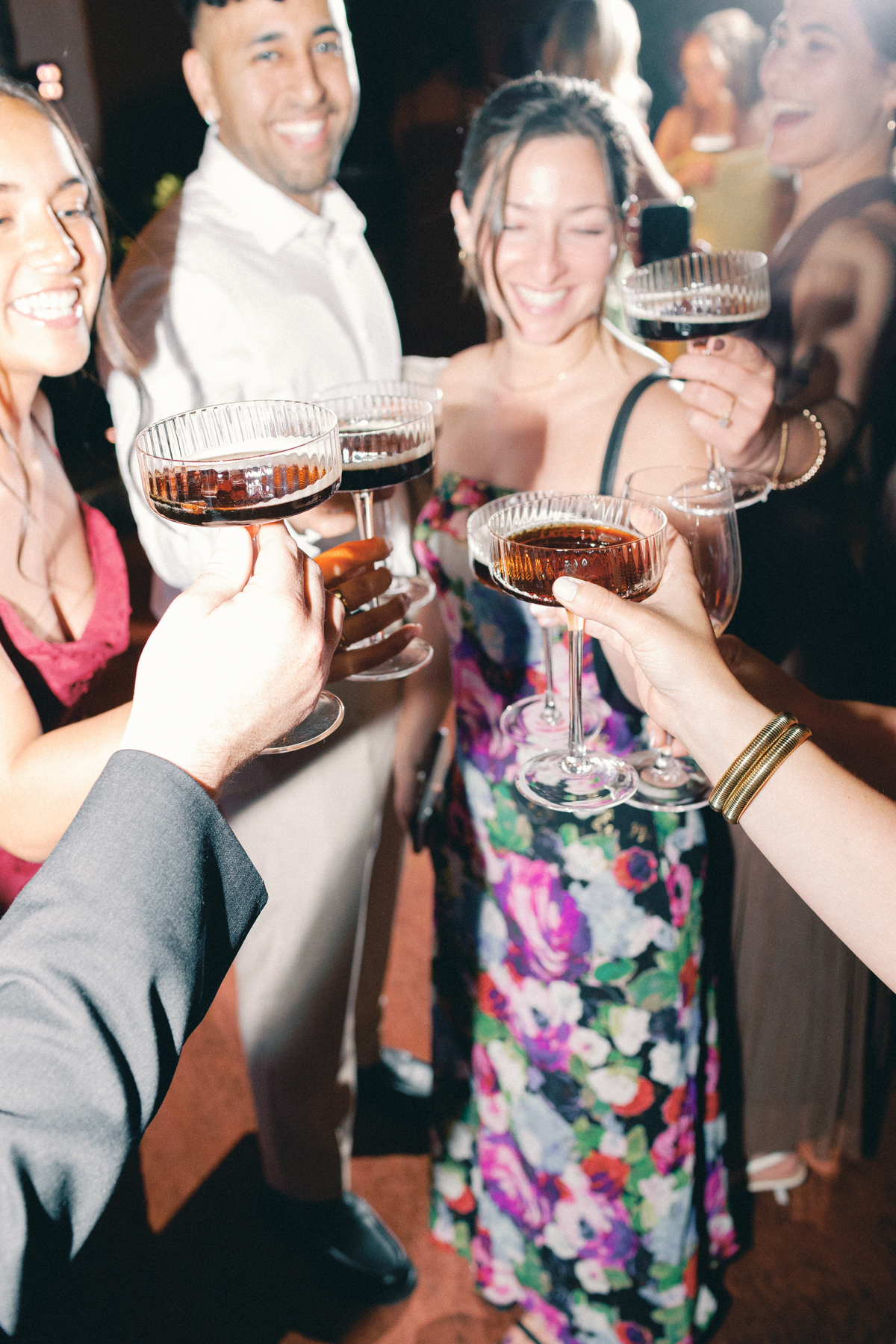 People clinking espresso martinis