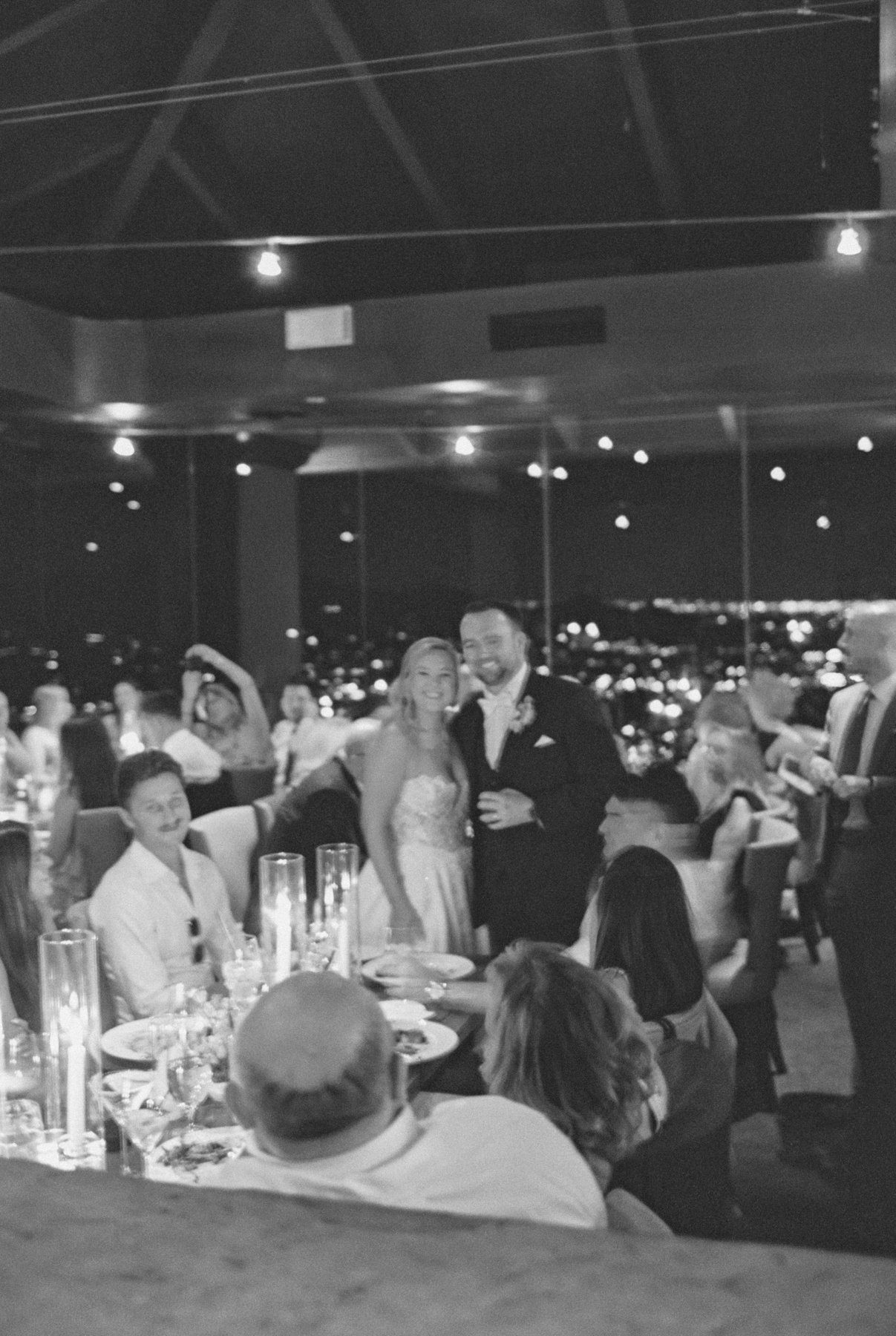 Bride and (groom) talking to guests
