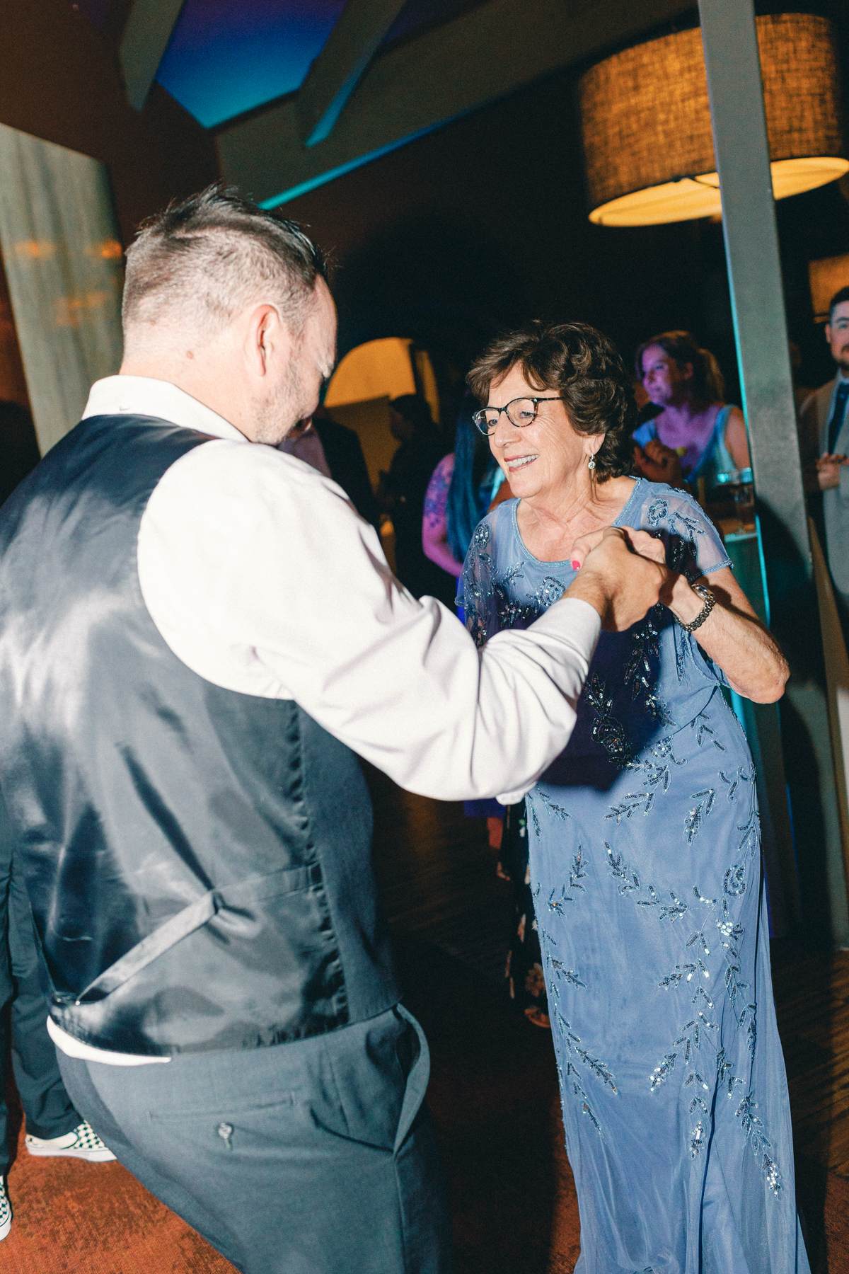 people dancing grandma and (groom)