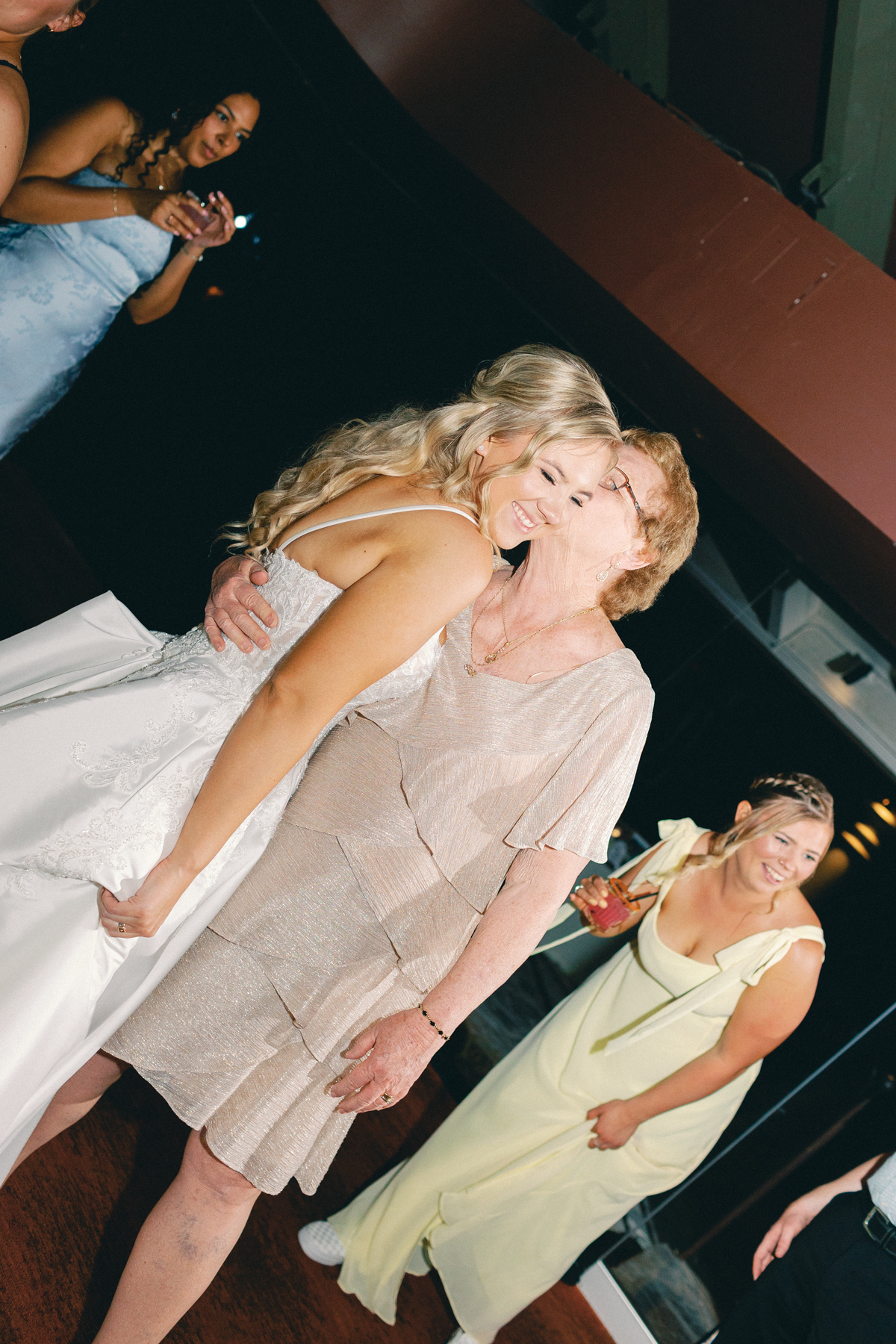 Grandma kissing bride
