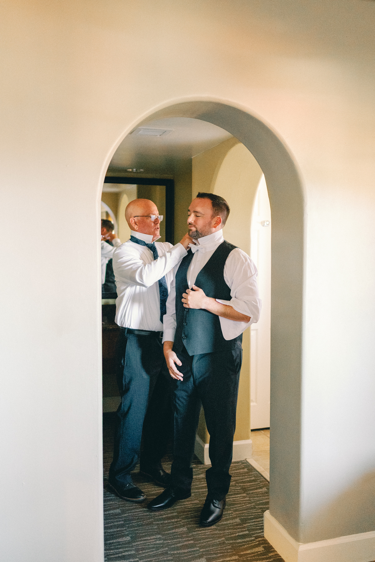 (groom)'s dad helping (groom)