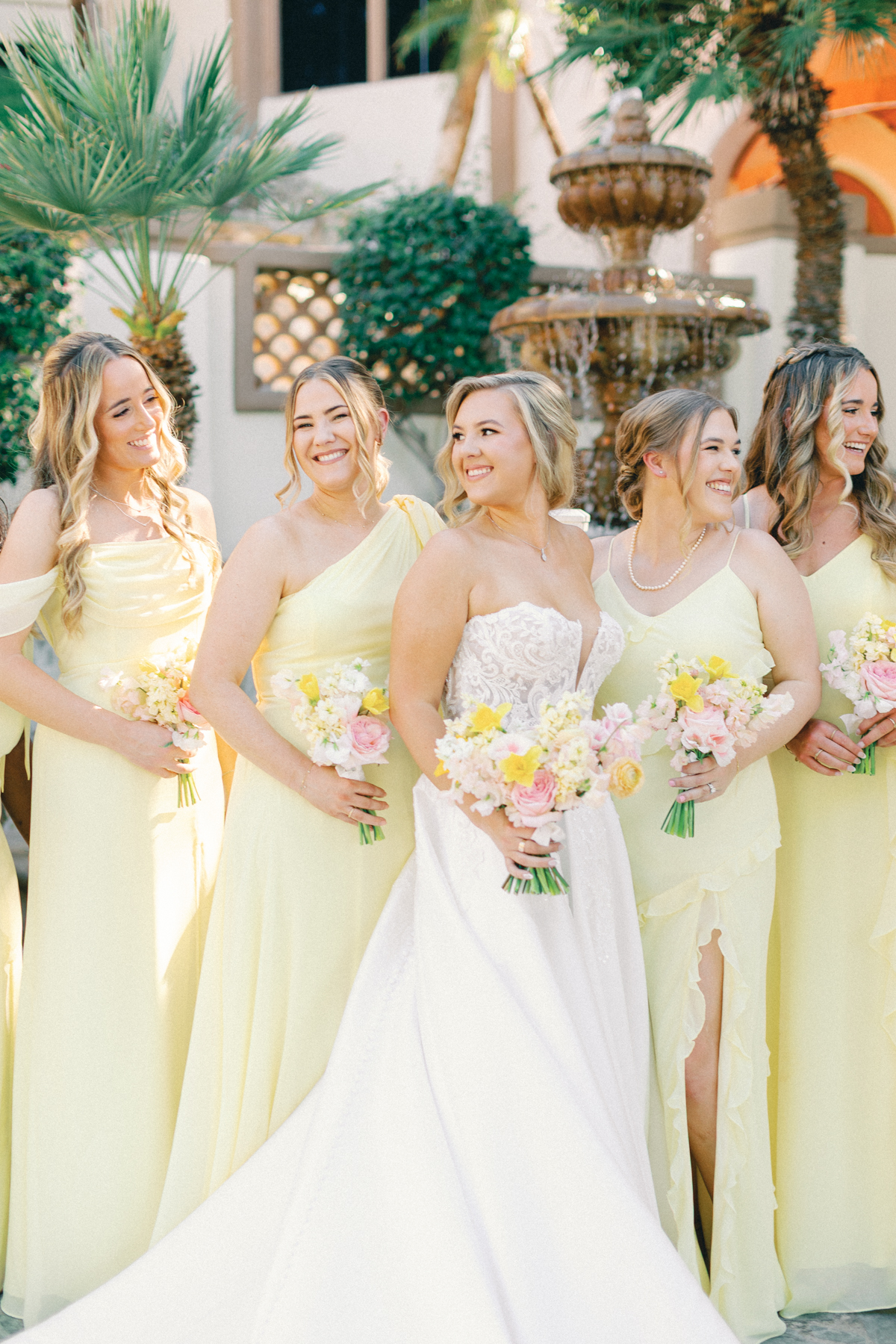 Bridesmaids and bride laughing