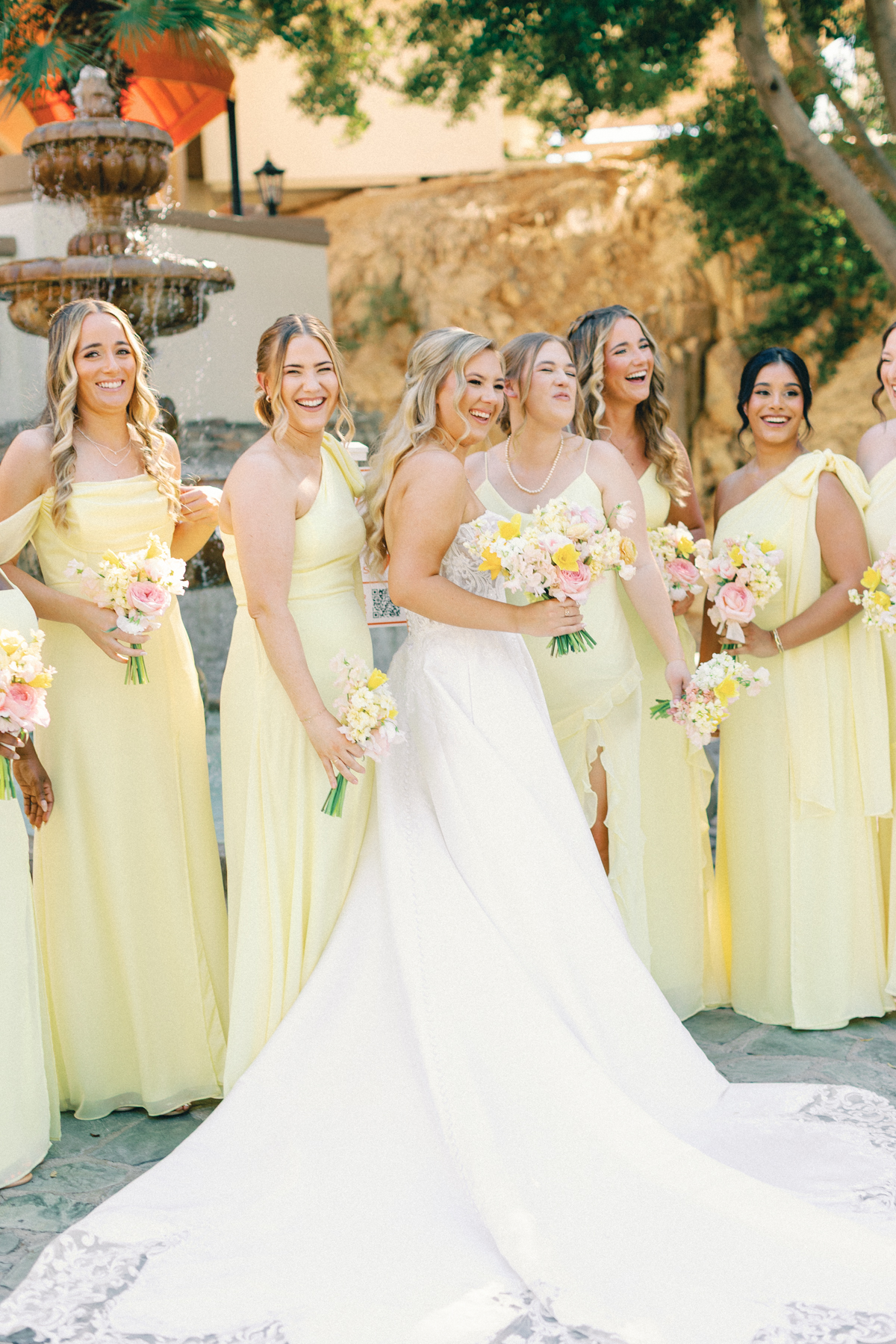 Bridesmaids and bride laughing