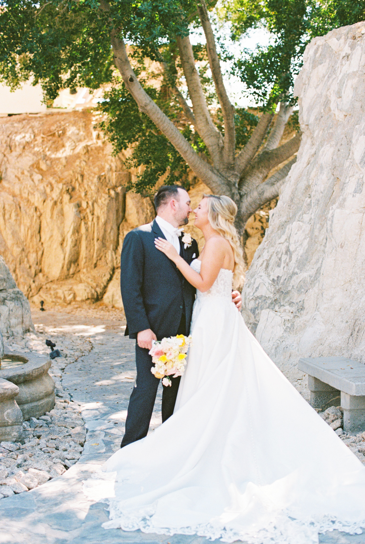 Bride and groom, kissing, and laughing