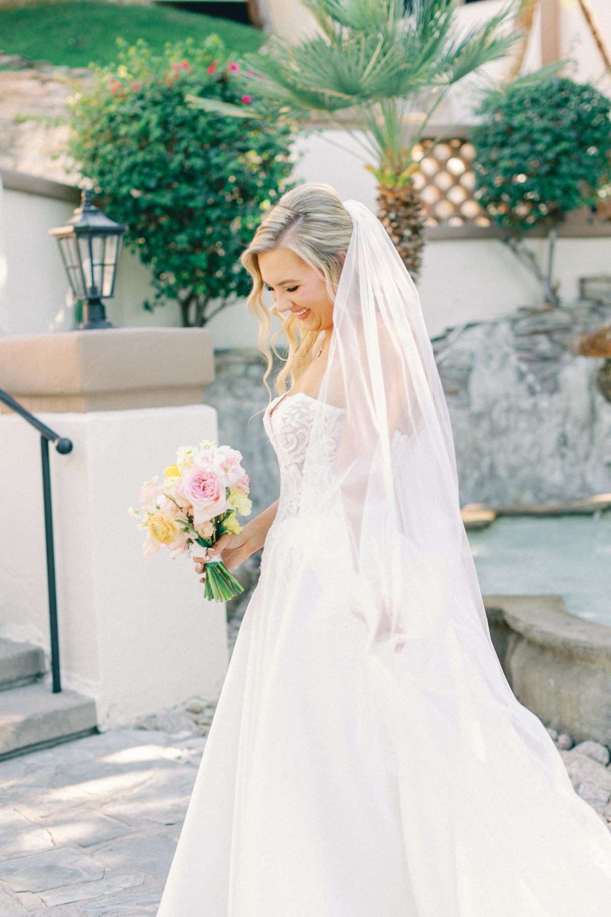 Bride playing with her veil
