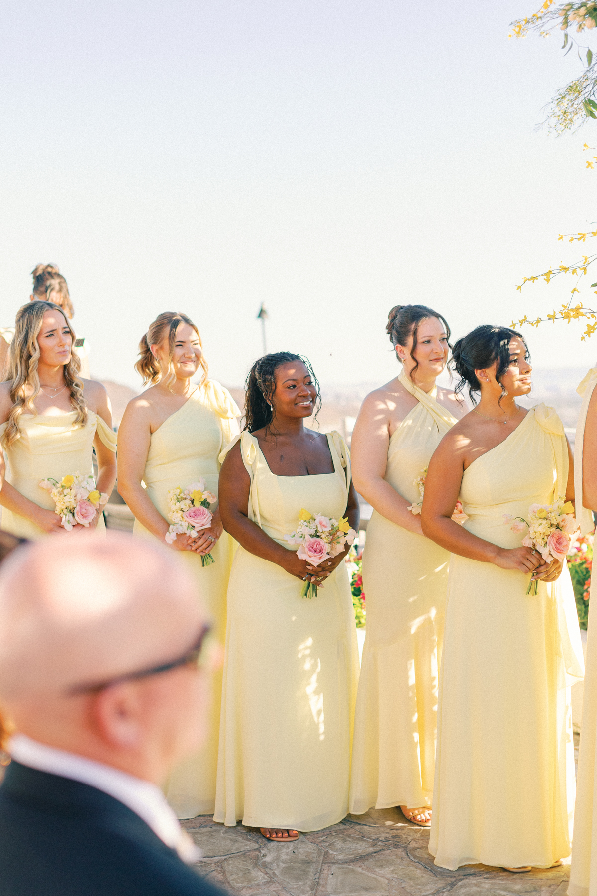 Bridesmaids looking at bride