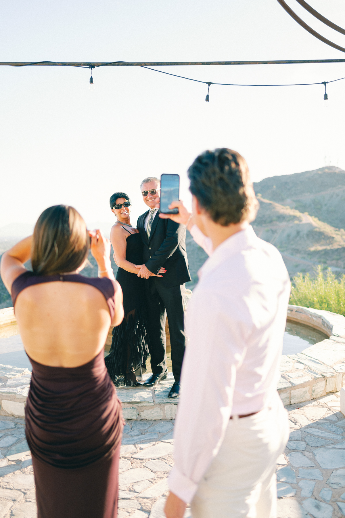 Cocktail hour portrait people taking photos