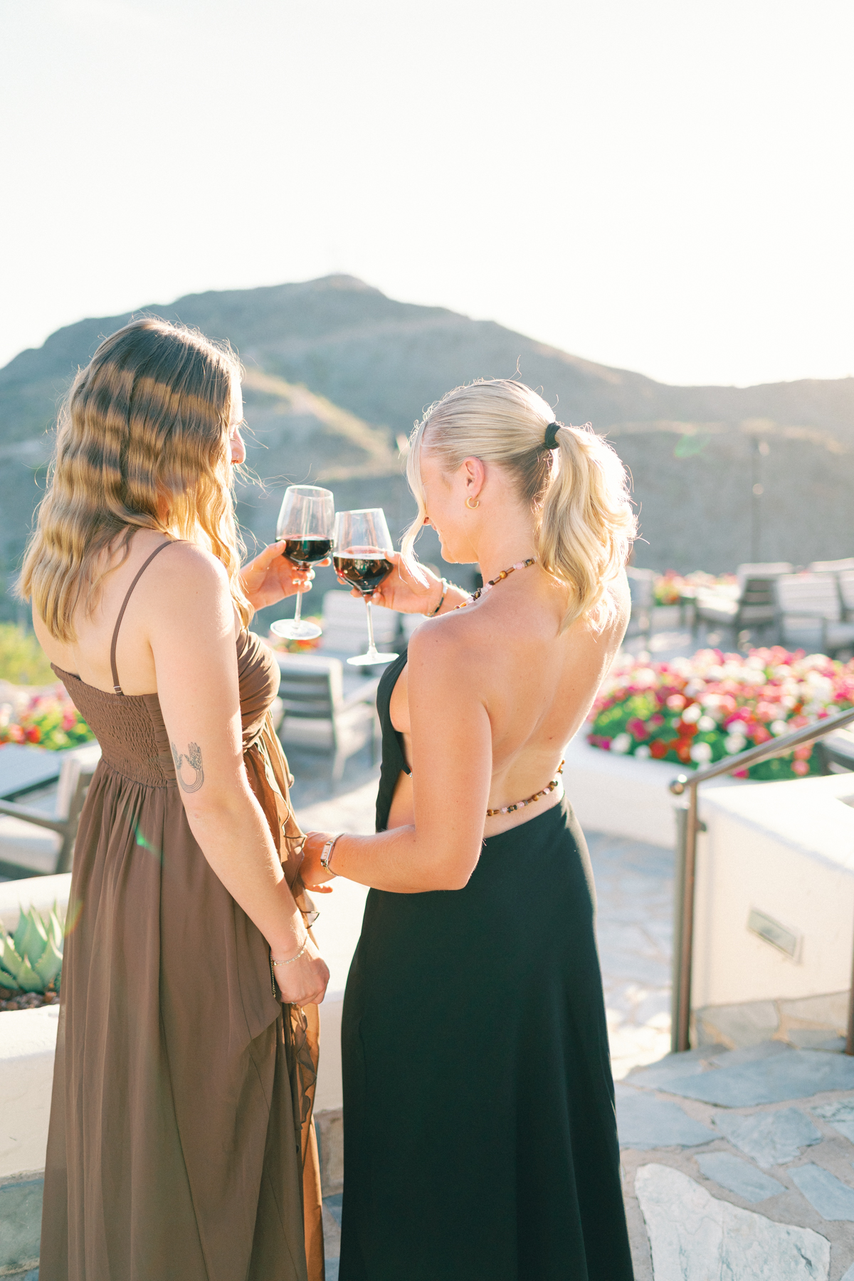 Cocktail hour portrait to girls clinking