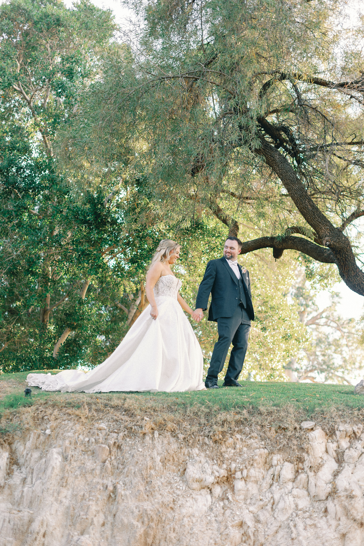 Bride and groom walking on mountain
