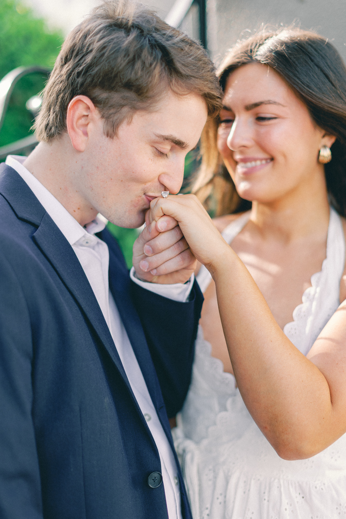 Him kissing her hand