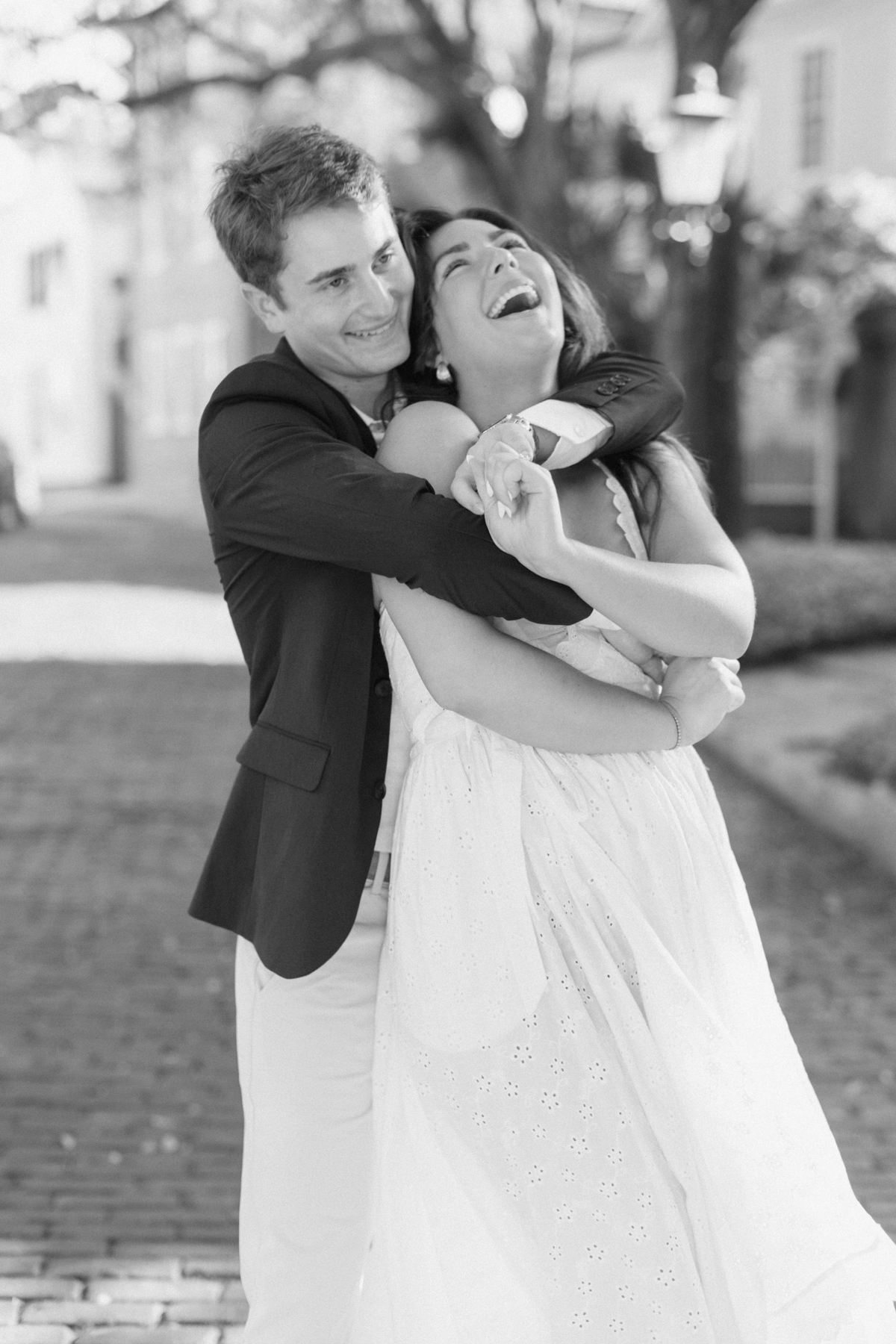 Couple holding each other laughing