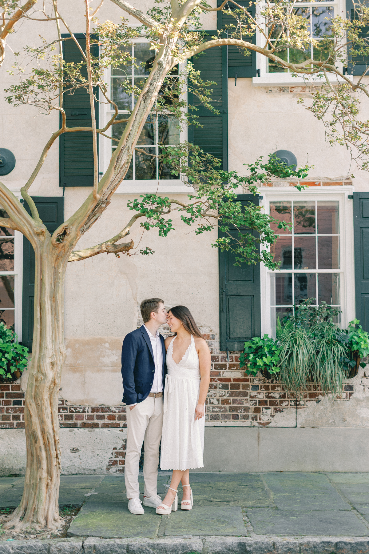 Couple kissing forehead