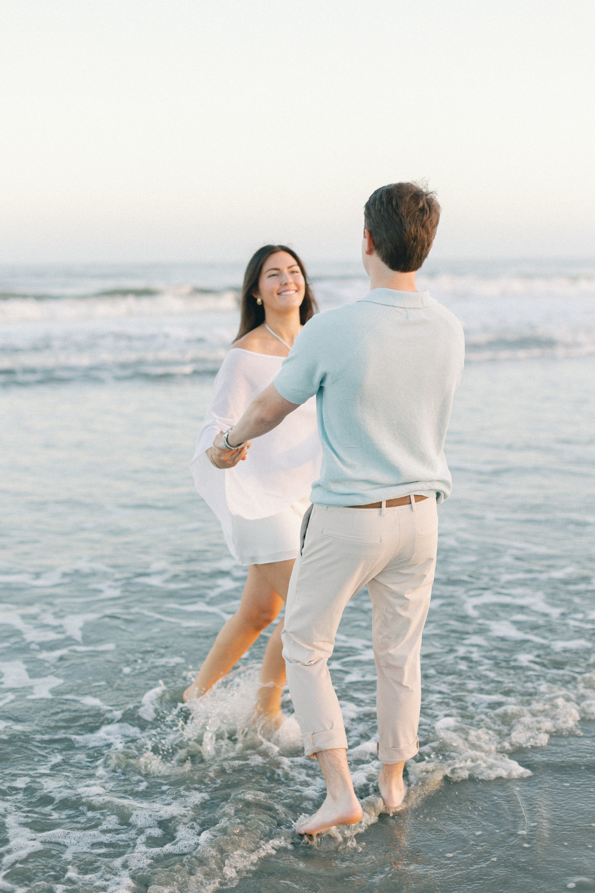 Couple twirling in water