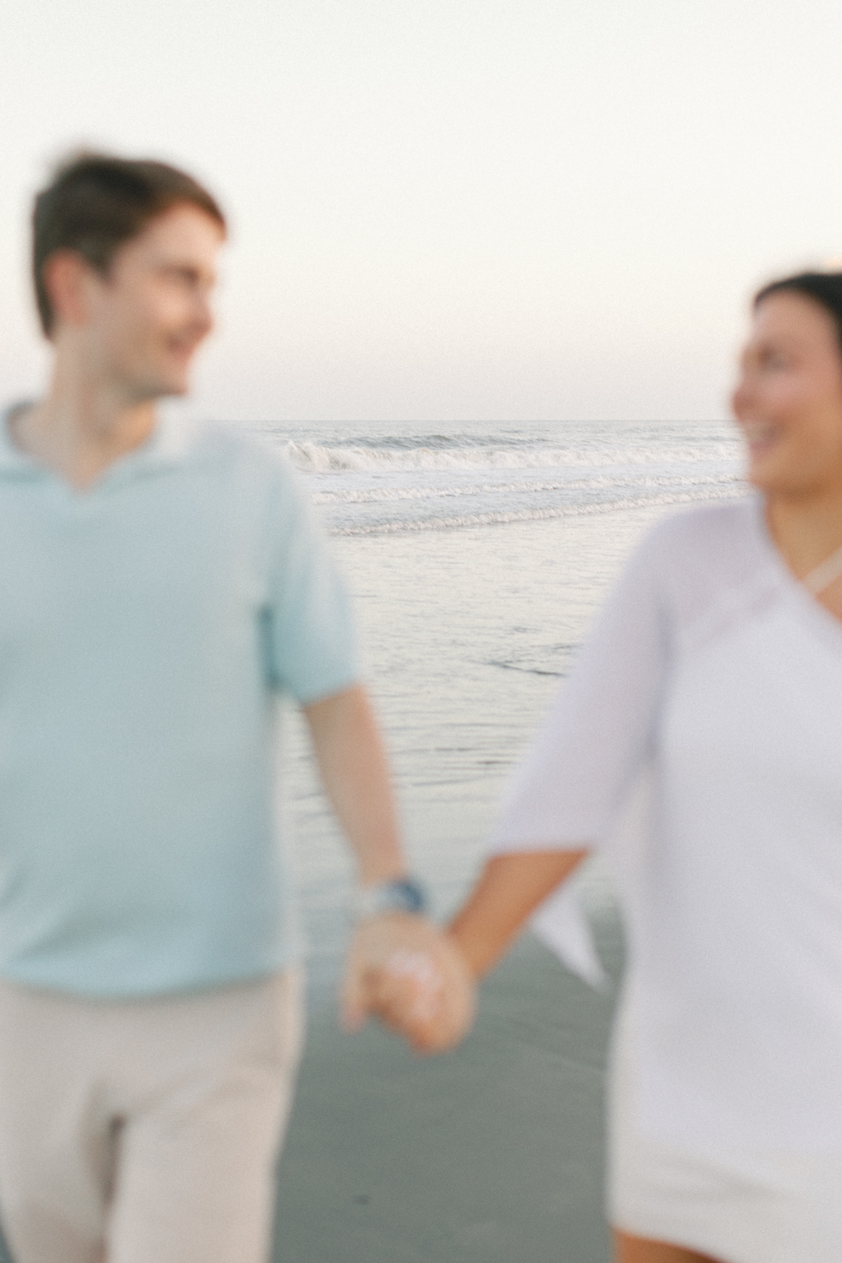 Couple out of focus, water, in focus