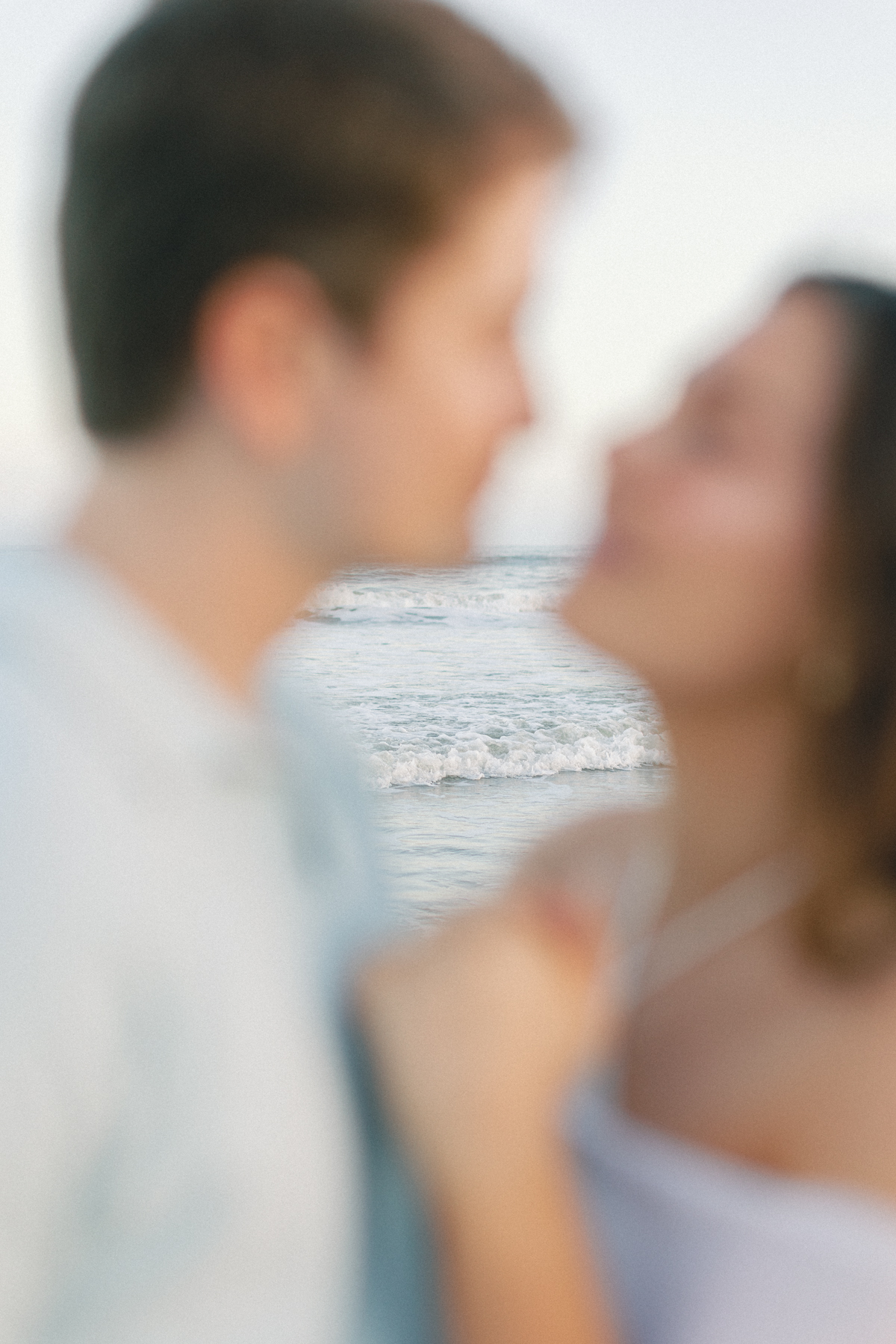 Couple out of focus, water, in focus