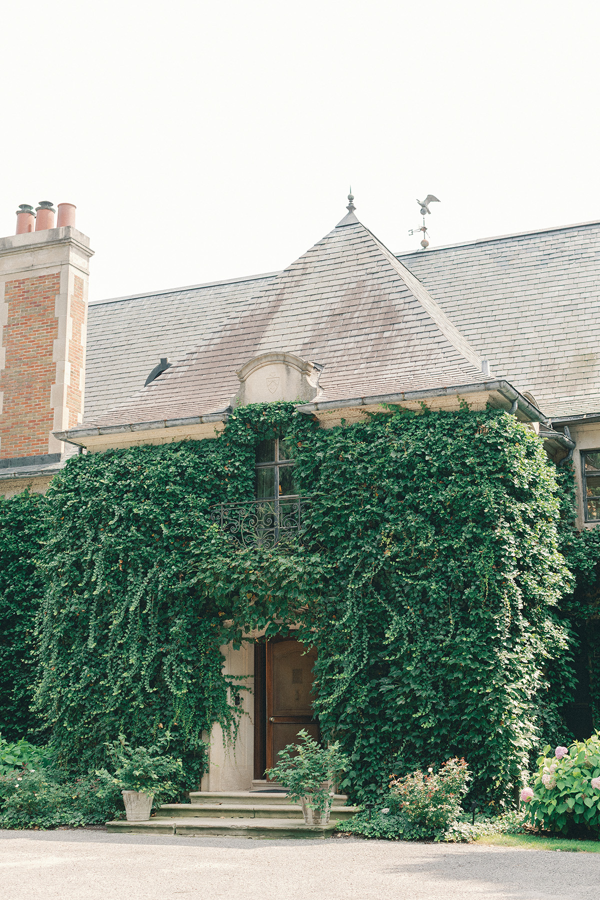 Ivy-covered brick facade at Greencrest Manor, a garden wedding venue in Battle Creek, Michigan