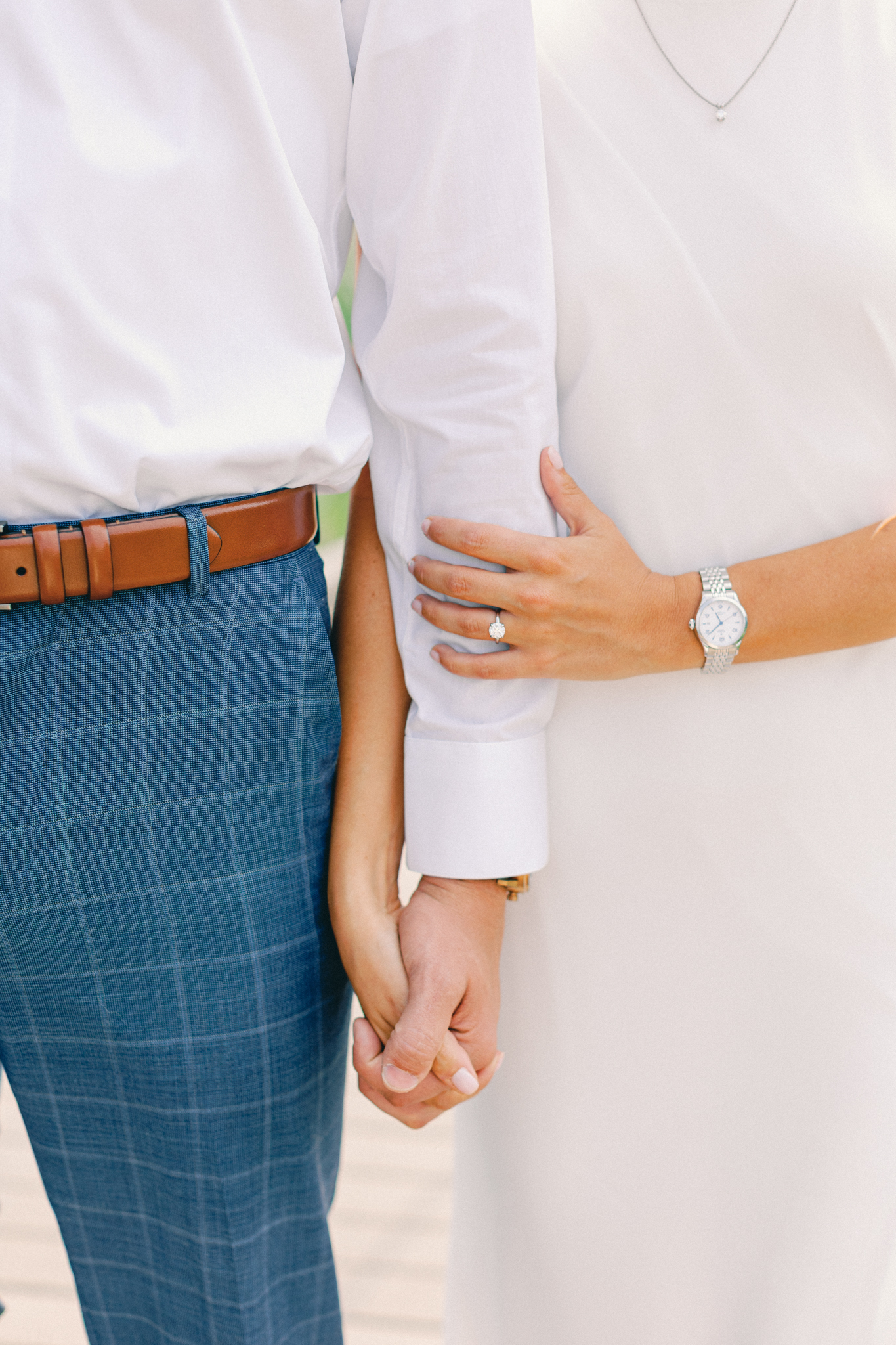 Close-up of Emma's engagement ring as the couple holds hands, Port Huron, Michigan engagement photography.