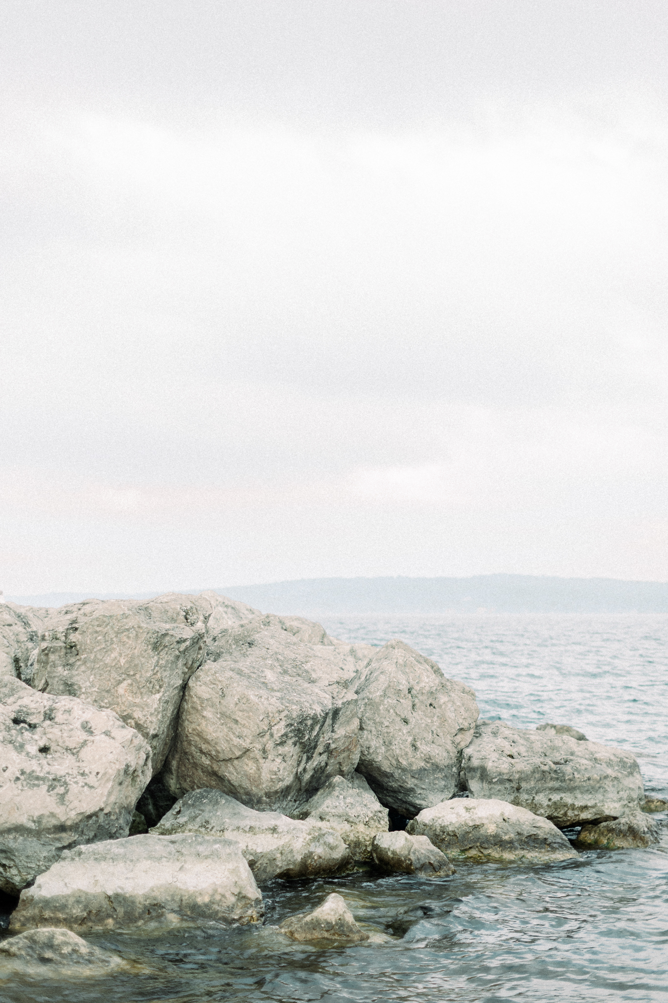 Limestone boulders along Grand Traverse Bay from Katie and Adam's Traverse City Michigan engagement photos